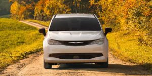 2026 Chrysler Voyager front profile standing still in middle of mountains