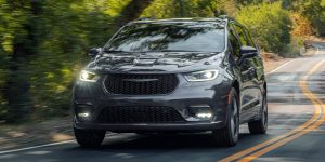 New 2026 Chrysler Pacifica Cruising in road in it's front profile
