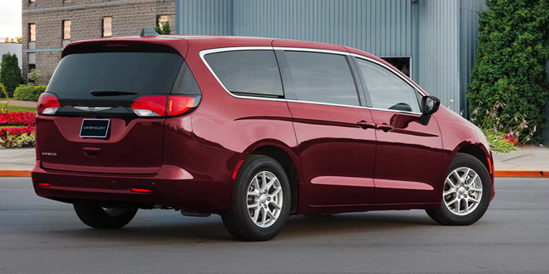 Red 2026 Chrysler Voyager Parked in back Side profile