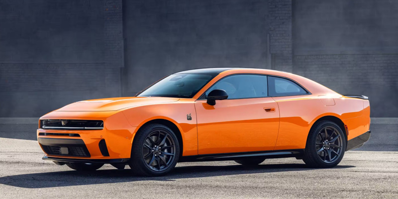 Orange 2026 Dodge Charger parked in it's front side profile